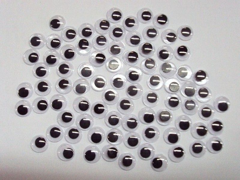 Ojos móviles redondos adhesivos negros 7 mm.